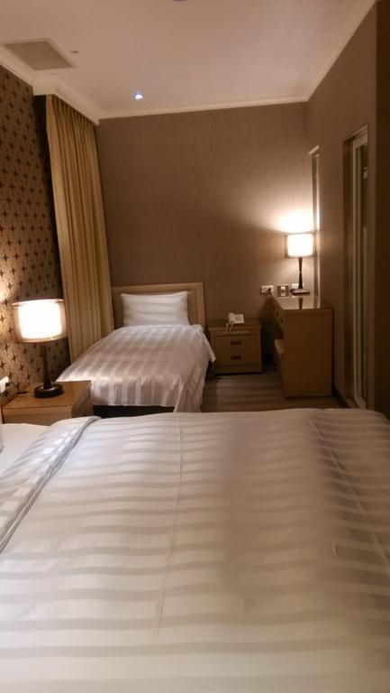 A casa Hotel Taoyuan Habitación foto
