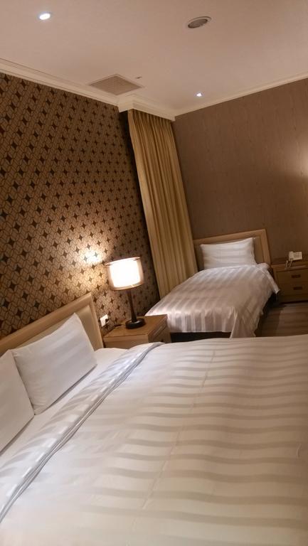 A casa Hotel Taoyuan Habitación foto